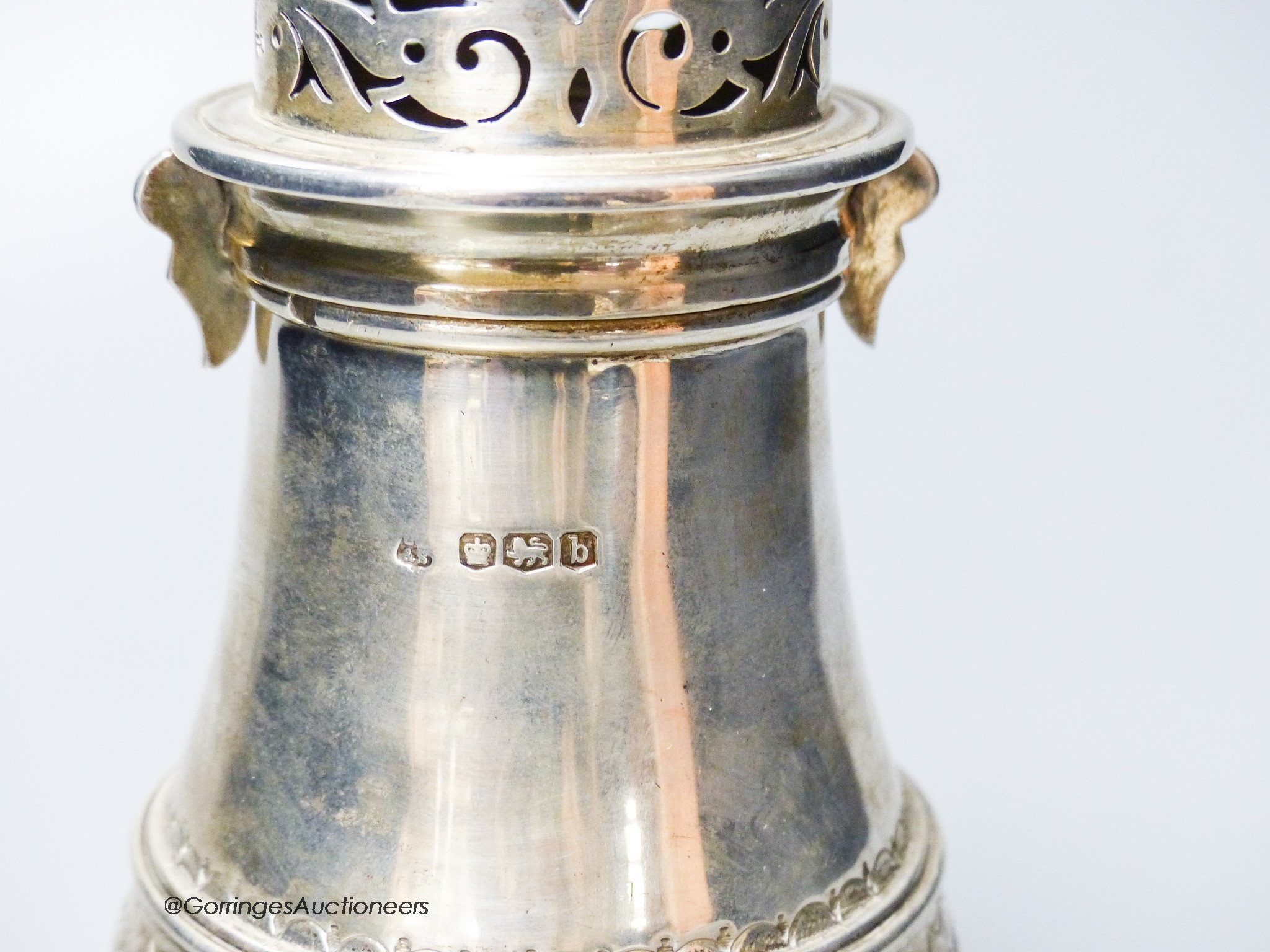 A George V silver baluster sugar caster, Thomas Bradbury & Sons, Sheffield, 1919, 21.3cm, 10oz.